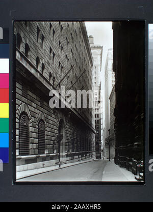 Federal Reserve Bldg, Manhattan Code: I.A.3. Massive facade of Federal Reserve building fills left side, looking down Maiden Lane, other buildings beyond. Citation/Reference: CNY# 148; Federal Reserve Bldg., Manhattan. Stock Photo