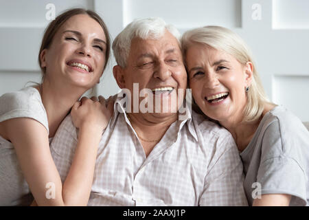 Head shot close up overjoyed two generations enjoying family time. Stock Photo