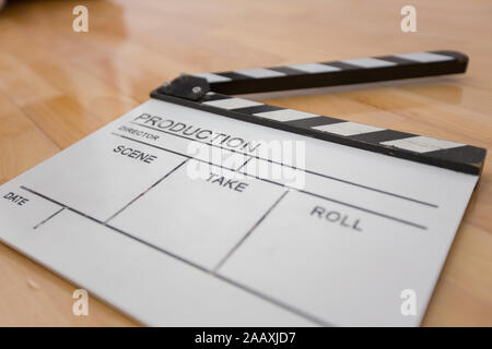 Movie clapper on wooden background, cinema concept Stock Photo
