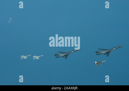 Two U.S. Air Force B-1B Lancers, escorted by an F-22 Raptor, two U.S. Navy EA-18G Growlers, and a KC-135 Stratotanker, with the 28th Expeditionary Air Refueling Squadron, conduct a mission in the U.S. Central Command area of operations, Oct. 25, 2019. The bombers flew directly from their home station of Ellsworth Air Force Base, S.D., demonstrating the U.S. Air Force’s ability to rapidly deploy strategic bombers anywhere in the world. Exercising the ability to operate bombers at expeditionary locations deters adversaries and demonstrates U.S. commitment to partners and allies in the region. (U Stock Photo