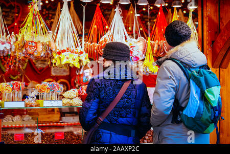 People at stall of cookies on Christmas Market Alexanderplatz Berlin reflex Stock Photo