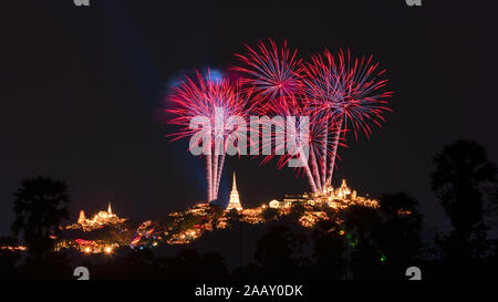 Beautiful colorful fireworks festival over the Phra Nakhon Khiri Historical Park on mountain in night time at Phetchaburi, Thailand Stock Photo