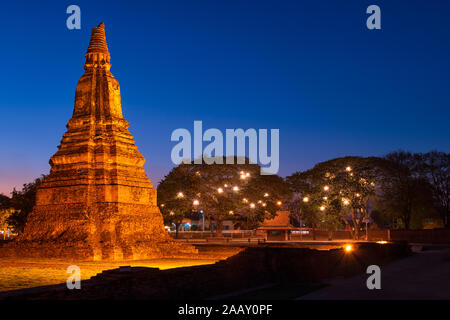 Beautiful ruins of ancient buddhist pagodas and stupas at historical park in night time which lights up beautifully. Stock Photo