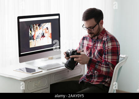 Young designer working on project from home Stock Photo