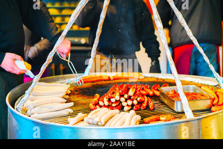Traditional Sausages on grill in Market in Berlin reflex Stock Photo