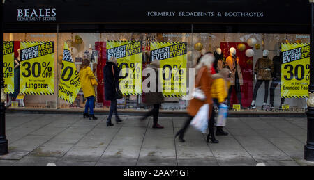 Southport, Merseyside, UK 24th November. Beales,  formerly known as Broadbents, is closing down with huge yellow closing down signs covering the windows of the Lord Street Store. Black Friday sales black tag event gets underway in Lord Street, as Christmas shoppers take advantage of the early discounts and store bargains.   Credit:MediaWorldImages/AlamyLiveNews Stock Photo