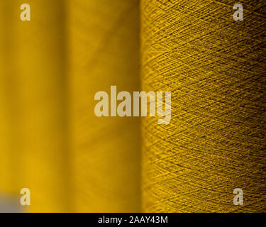 yarn of wool roll used for weaving sweater in an handloom industry Stock Photo