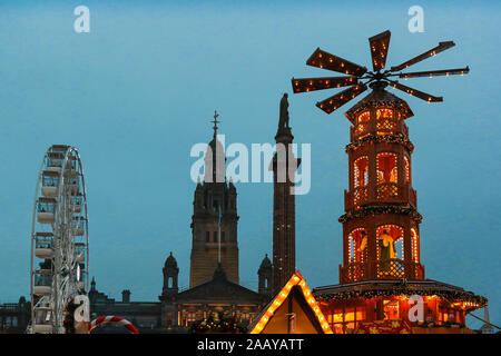 Glasgow, UK. 24 November 2019. As part of Glasgow's festive celebrations, the annual Christmas market officially opened in the city's George Square in the shadow of the City Chambers with a funfair and international food markets. Credit: Findlay/Alamy News Stock Photo