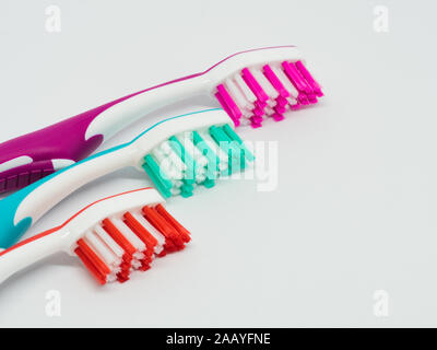 three toothbrushes on white background Stock Photo