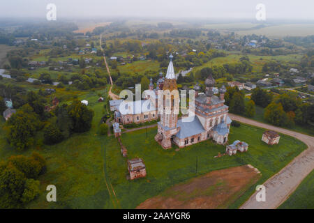 View of the old temple complex in the Parskoe village on a foggy September morning (aerial photography). Ivanovo region, Russia Stock Photo