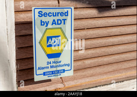 Secured by ADT window sticker, security, 24 hour Alarm Monitoring. Stock Photo
