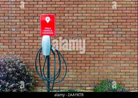 Tesla Electric Car charging point with copy space Stock Photo