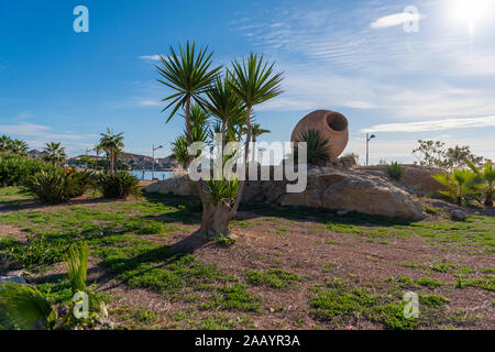 clay pot in park nest to decoration plants. Stock Photo