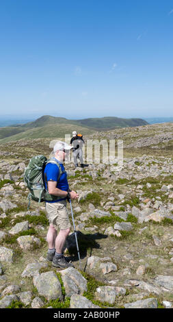 Walkers on summit of Red Pike, Lake District, Cumbria Stock Photo