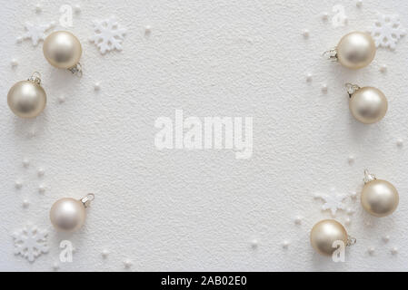 Snow background with Christmas decorations balls and snowflakes with place for your text. Stock Photo