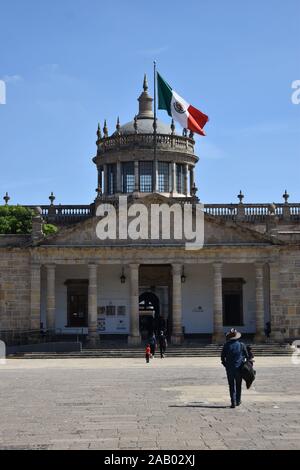 The Mexican flag flies over Hospicios Cabañas in Guadalajara, Jalisco, Mexico, an old hospital and orphanage, is now home to murals by Jose Orozco. Stock Photo