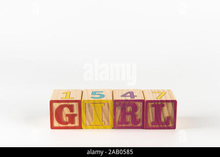 A child's alphabet toy spelling word block set, spelling out the word girl. Stock Photo