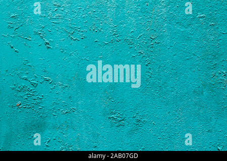 Grunge weathered cracked painted plastered wall closeup as turquoise background Stock Photo