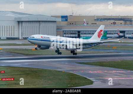 London, England - Circa 2019 : Air China Airbus A330 Aircraft B-6115 Landing at London Heathrow Airport Stock Photo