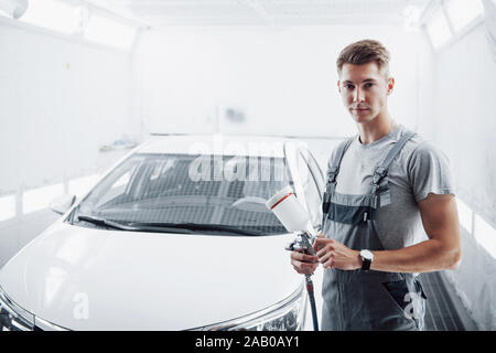 Paint spray master for car painting in the automotive industry. Stock Photo