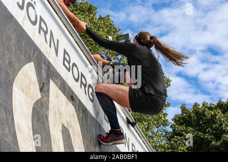 Though Viking race participant climbing up an obstacle in Helsinki, Finland Stock Photo