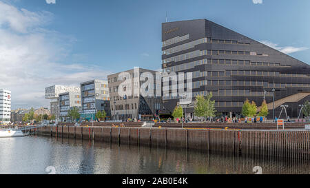 TRONDHEIM, NORWAY - SEPTEMBER 7, 2019: The Snohetta Powerhouse modern office block that generates it's own power via a covering of solar panals. Stock Photo