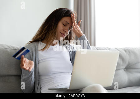 Woman feels stressed having access problem to e-banking Stock Photo