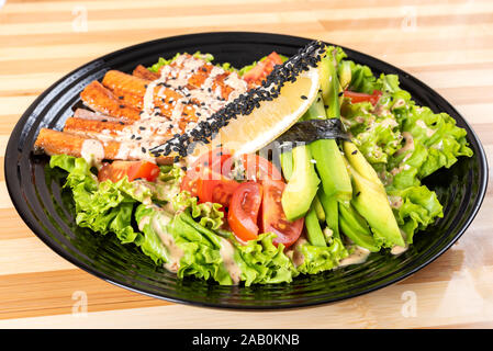 Salmon grilled salad, with herbs and lemon. Stock Photo