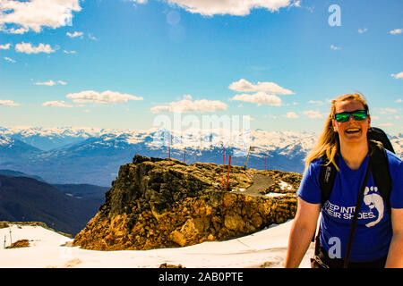 June 16 2018, Whistler Canada: Editorial photo of a girl joyfully laughing on a mountain. Whistler is a popular hiking mountain. Stock Photo