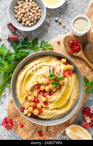 Chickpea hummus with tahini in a bowl. Healthy vegetarian appetizer. Middle Eastern cuisine Stock Photo