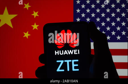 Silhouette of smartphone in a user's hand with glowing Huawei and ZTE logos on the screen. Flags of China and USA on the blurred background.