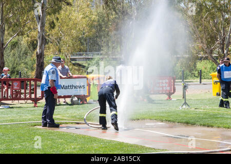 Water exploding from improperly connected hydrant at Australian Firefighters Championships at Tamworth . Stock Photo