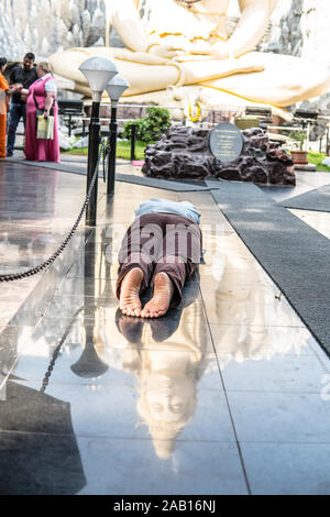 Bengaluru Shivoham Shiva Temple, Sacred complex of Shiva The Auspicious One, Ganesh statues, healing stone. praying Indian Hindus lying on ground Stock Photo