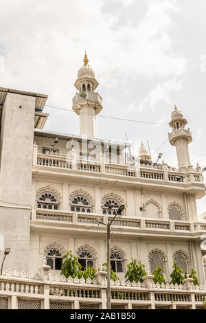 Bengaluru city, Muslim Jamia Masjid mosque, religion of Islam, tall white towers with gold moon in shape of crescent and star as Islamic symbol Stock Photo