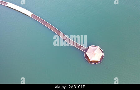 Beijing, China. 23rd Nov, 2019. Aerial photo taken on Nov. 23, 2019 shows a view of the Danjiangkou reservoir in Nanyang City, central China's Henan Province. The Danjiangkou Reservoir is the water source of the central route of China's south-to-north water diversion project. Credit: Feng Dapeng/Xinhua/Alamy Live News Stock Photo