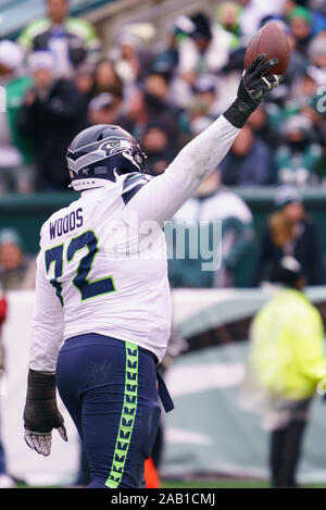 SEATTLE, WA - NOVEMBER 27: Seattle Seahawks defensive tackle Al Woods (99)  brings down Las Vegas Rai