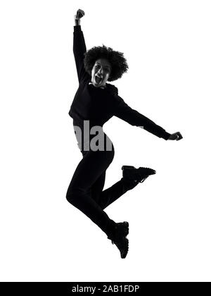 one mixed race african young teenager girl woman jumping happy in studio shadow silhouette isolated on white background