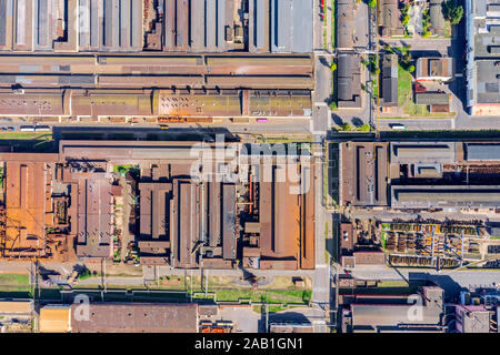 top down view of rusty roofs of industrial buildings and warehouses. industrial background Stock Photo