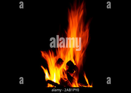 Fire texture isolated on black background. Fire flames on black background. Fire patterns. Texture of flames throughout the space. Red flames up close Stock Photo