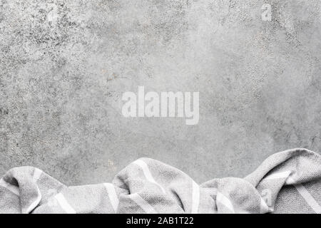Grey cement or concrete background and linen textile. Design background, modern kitchen food cooking concept with copy space Stock Photo