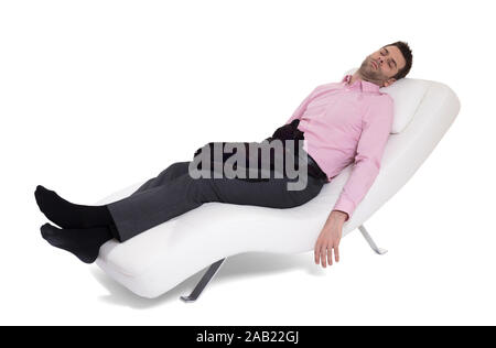 Man client sitting with psychologist on the comfortable couch during the psychological session, cat on lap Stock Photo