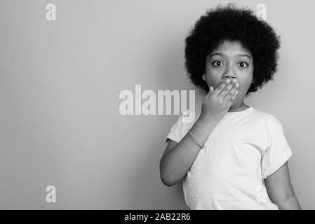 Young cute African girl with Afro hair in black and white Stock Photo