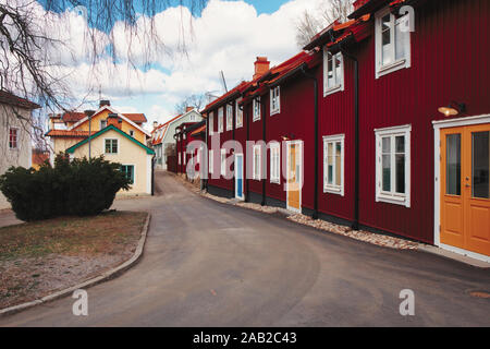 Street of timber falu red houses, Strangnas, Sodermanland County, Sweden Stock Photo