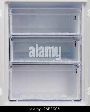 Refrigerator freezer compartment. Clean empty plastic rack Stock Photo