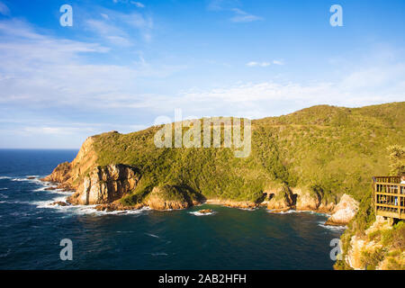 Knysna Heads. Looking from East Head to West Head with caves in Featherbed Nature Reserve Stock Photo