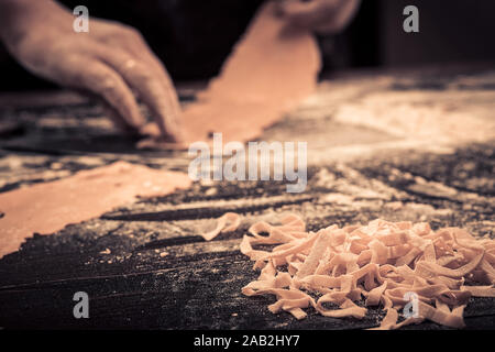 The chef makes fresh spaghetti from scratch. Stock Photo