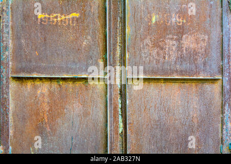 Detail of rusty corroded metal flat shutter or door. Old red metal texture background Stock Photo