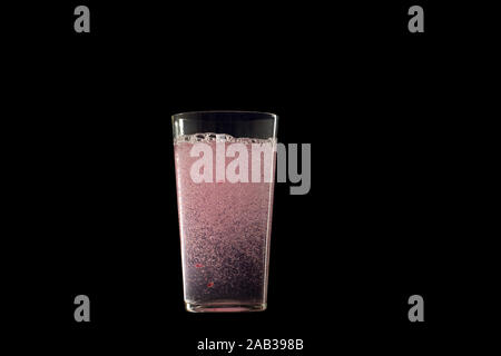 Studio shot of fresh soda drink with raspberry on black background. Detox water drink in glasses . Stock Photo