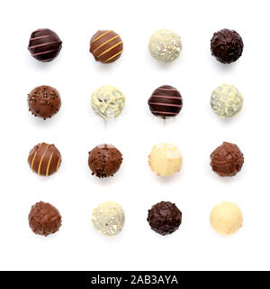 Top view of various chocolate pralines isolated on white background Stock Photo