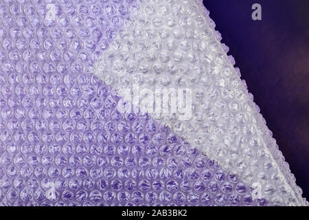 Packaging bubble wrap on color background Stock Photo